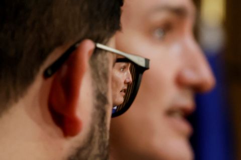 Canadian Prime Minister Justin Trudeau is reflected in the glasses of Chilean President Gabriel Boric during a news conference in Ottawa on Monday, June 6.