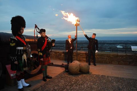A Platinum Jubilee beacon is lit by Lord Provost Robert Aldridge and Commander of Edinburgh Garrison Lt. Col. Lorne Campbell at Scotland's Edinburgh Castle on Thursday, June 2. More than 1,500 towns, villages and cities throughout the UK, Channel Islands, Isle of Man and UK Overseas Territories lit a beacon to mark <a href=