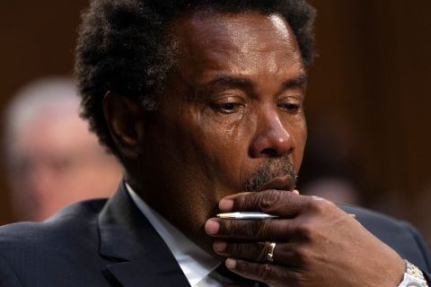 Garnell Whitfield, whose mother was killed in the Buffalo supermarket mass shooting, wipes away tears as he testifies during a Senate hearing on domestic terrorism on Tuesday, June 7. <a href=
