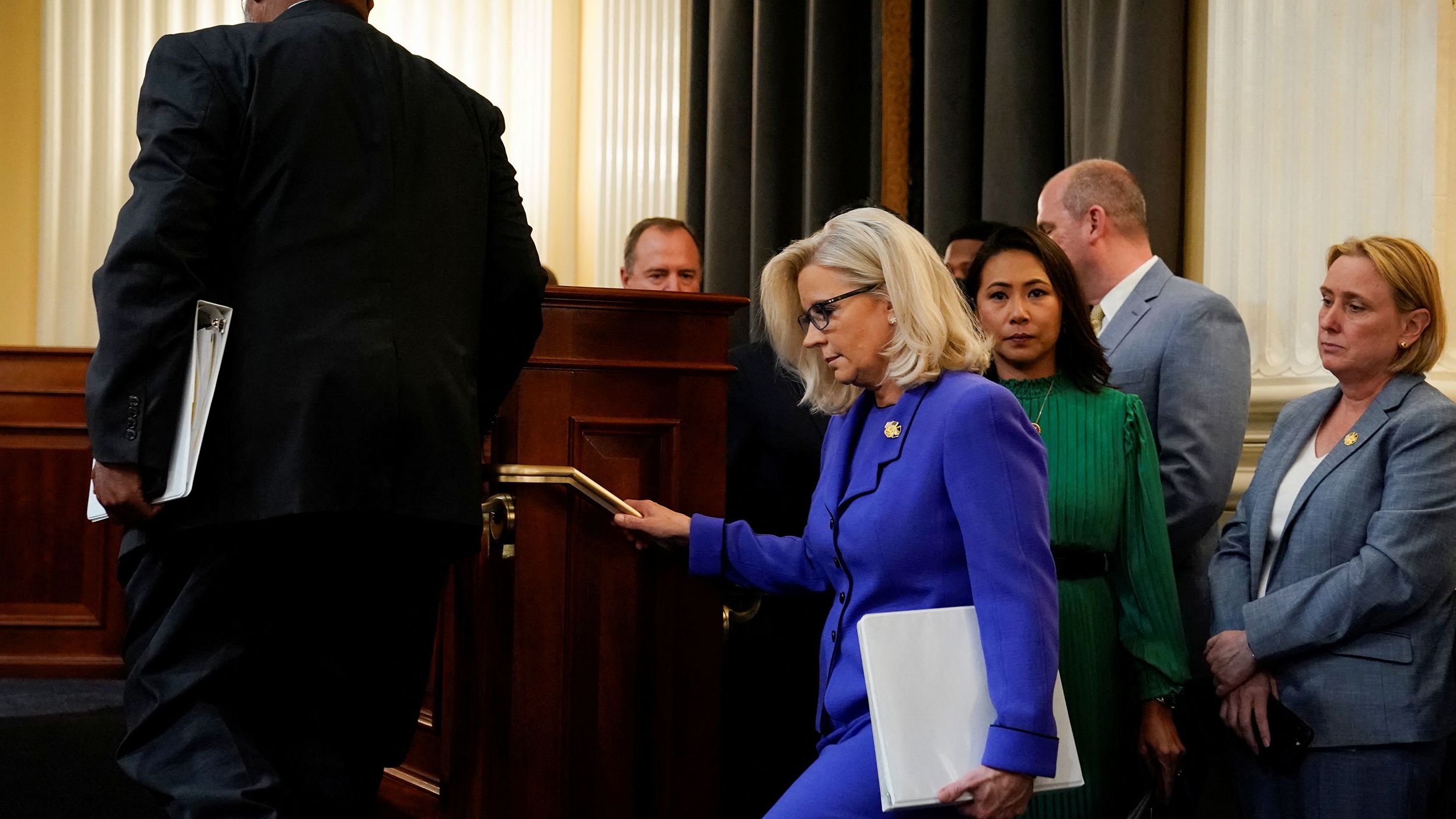 The committee members arrive for the June 9 hearing.