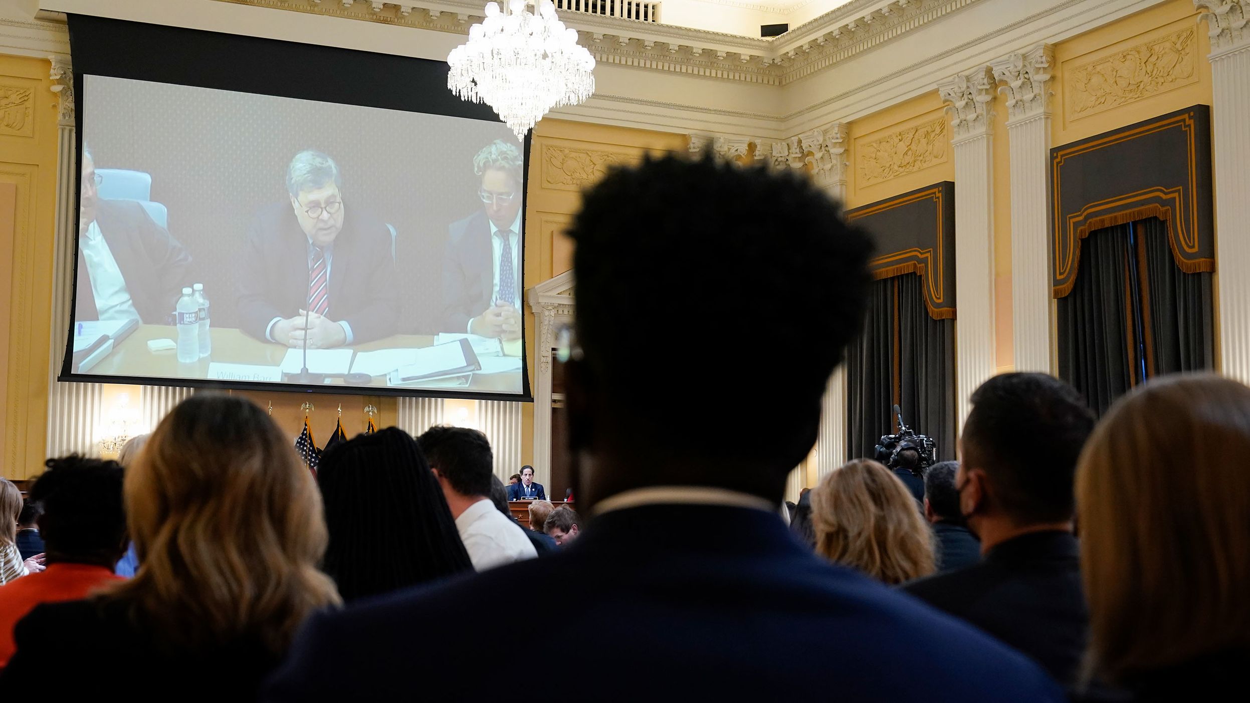 Video of former Attorney General Bill Barr's <a href="index.php?page=&url=https%3A%2F%2Fwww.cnn.com%2Fpolitics%2Flive-news%2Fjanuary-6-hearings-june-9%2Fh_fac1c0336ddf0c92de37b86aa79292ef" target="_blank">closed-door deposition</a> is shown during the June 9 hearing. Barr, who resigned in December 2020, said part of the reason that he left the Trump administration was because of the false claims of fraud Trump was making.