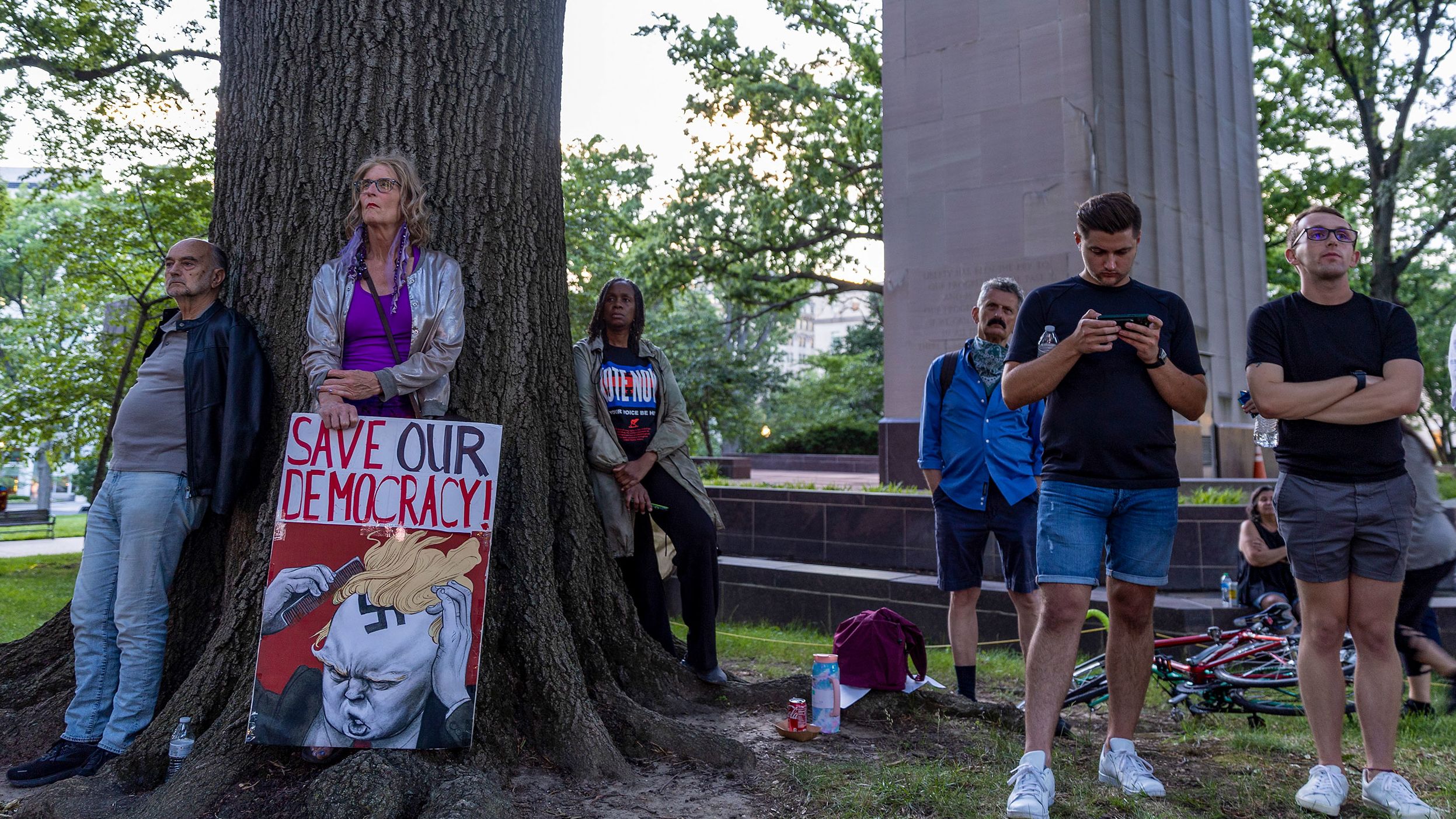 People gather in Washington to watch the first hearing.