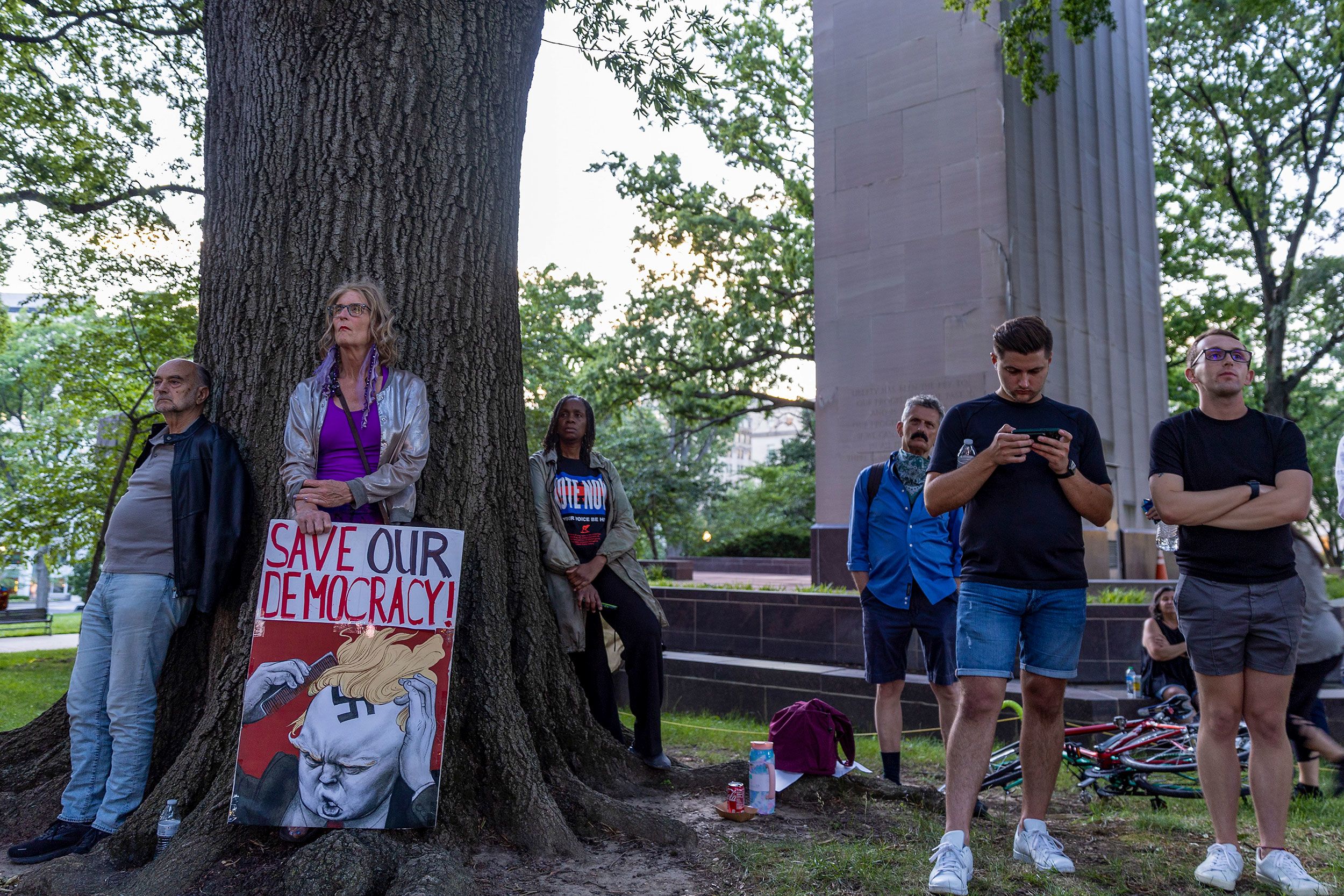 People gather in Washington to watch the first hearing.