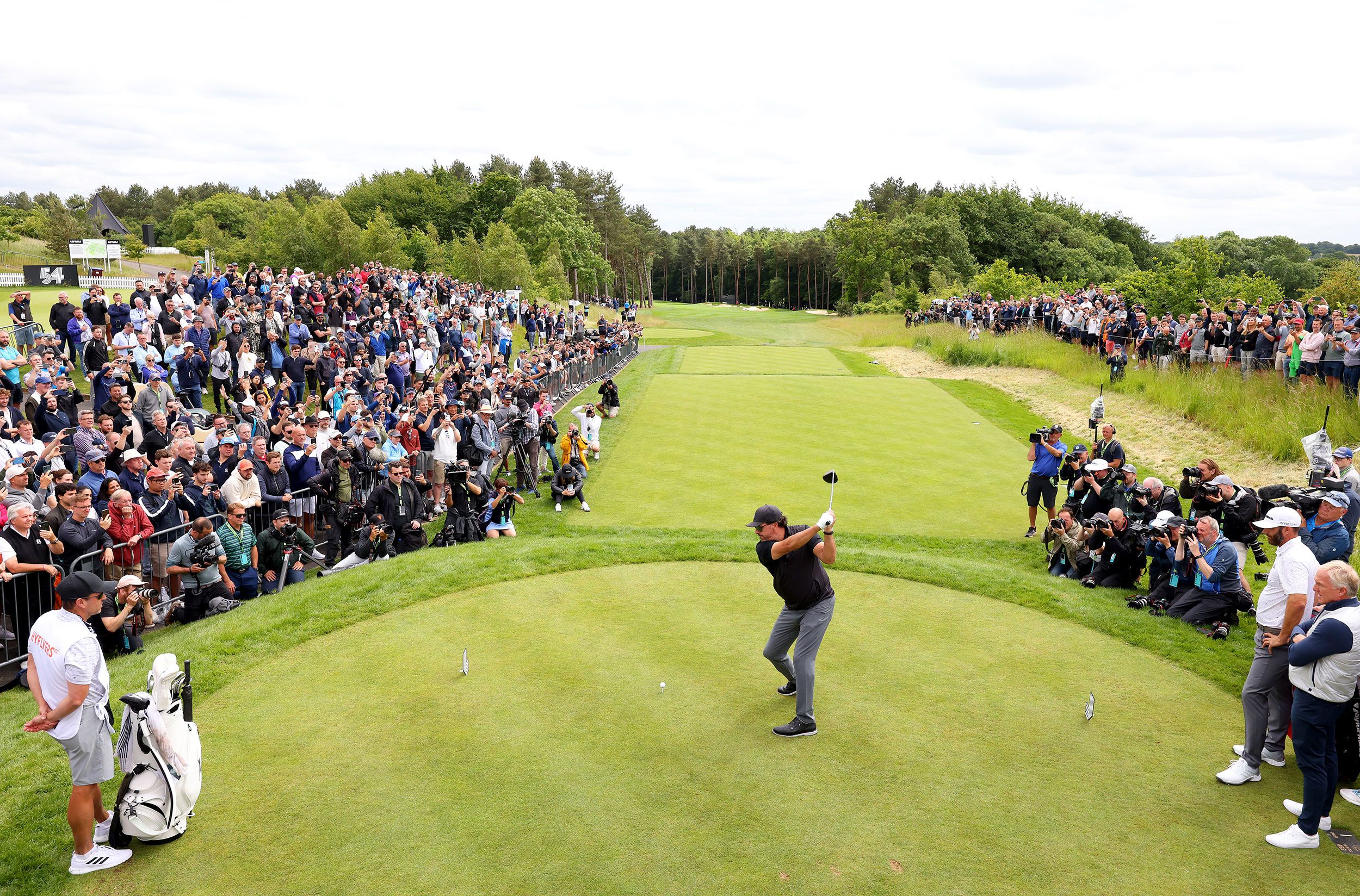 Phil Mickelson hits his opening tee shot at the LIV Golf Invitational in London.