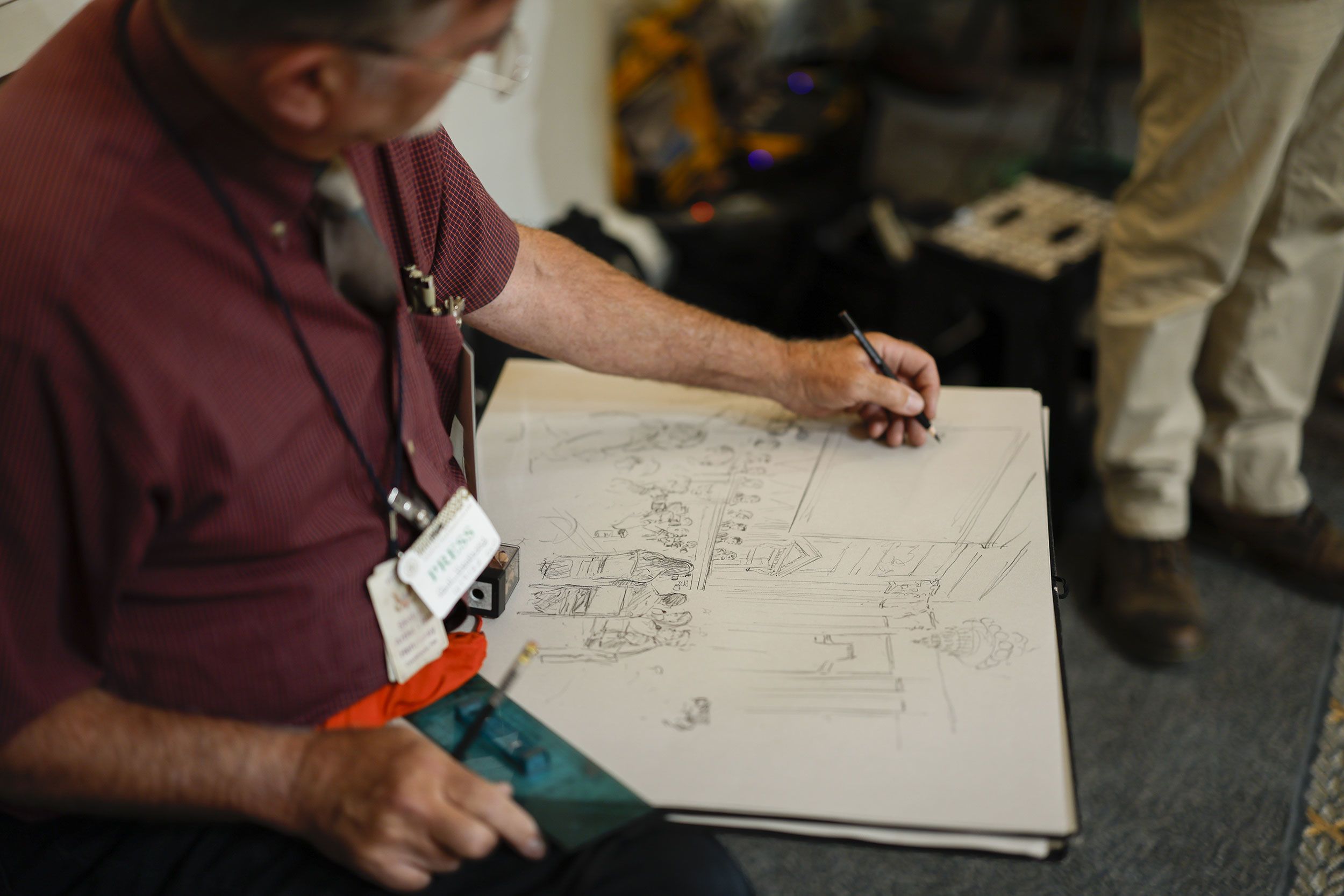 A sketch artist draws during the first hearing.