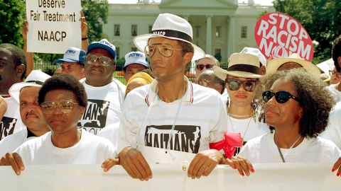 Ashe during a demonstration against the Bush administration's policy on Haiti outside the White House on September 9, 1992. 