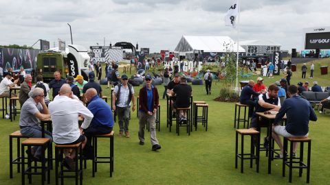 Spectators enjoy the fan zone ahead of the start of the inaugural LIV Golf event.
