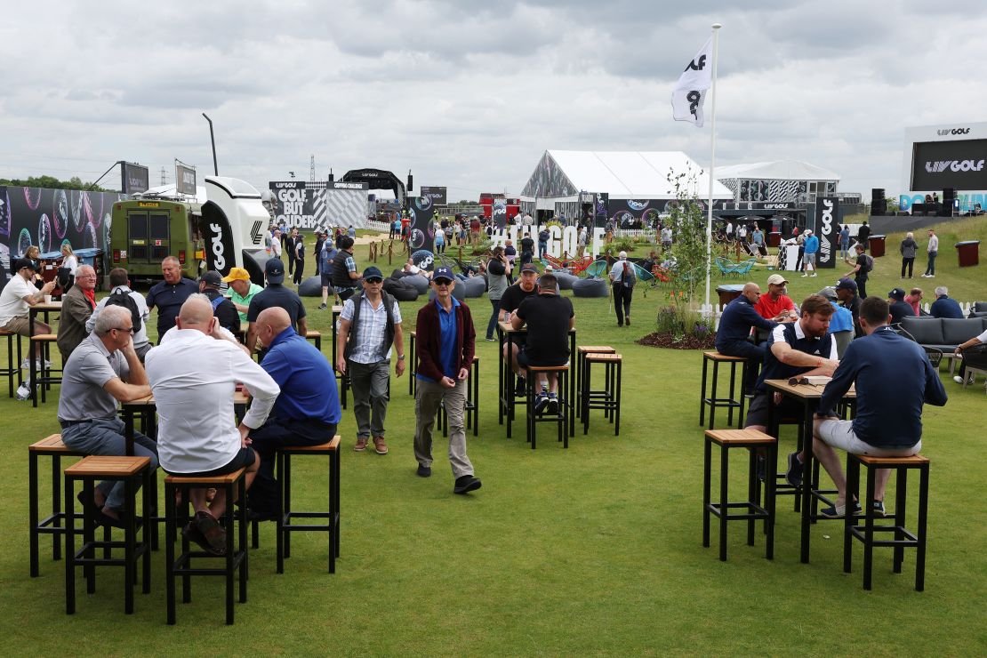 Specators enjoy the fan zone ahead of the start of the inaugural LIV Golf event.