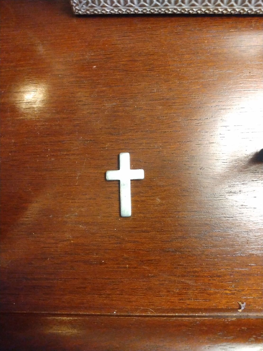 Ashlye Wilkerson keeps this silver cross as a memento from the traffic stop.