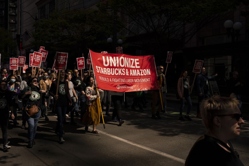 Demonstrators during the 'Fight Starbucks Union Busting' rally in Seattle, Washington, on April 23, 2022.