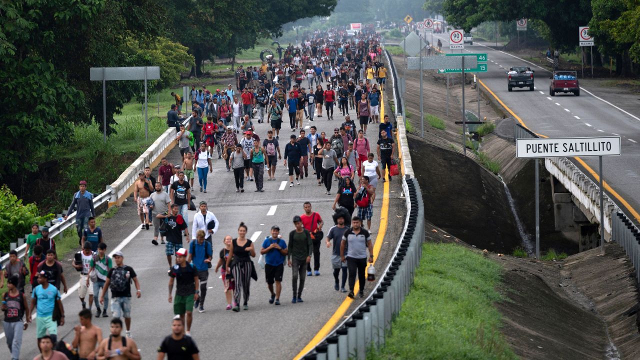 Migrants taking part in a caravan heading to the US, walk from Huixtla to Escuintla, Chiapas state, Mexico, on June 9, 2022. 