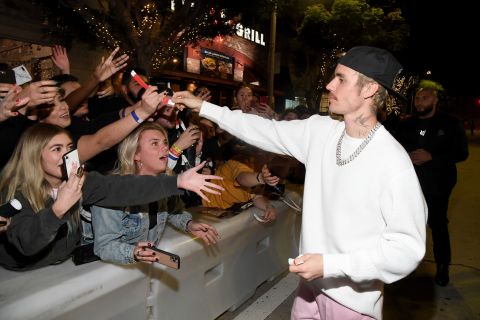 Bieber interacts with fans at the premiere of 
