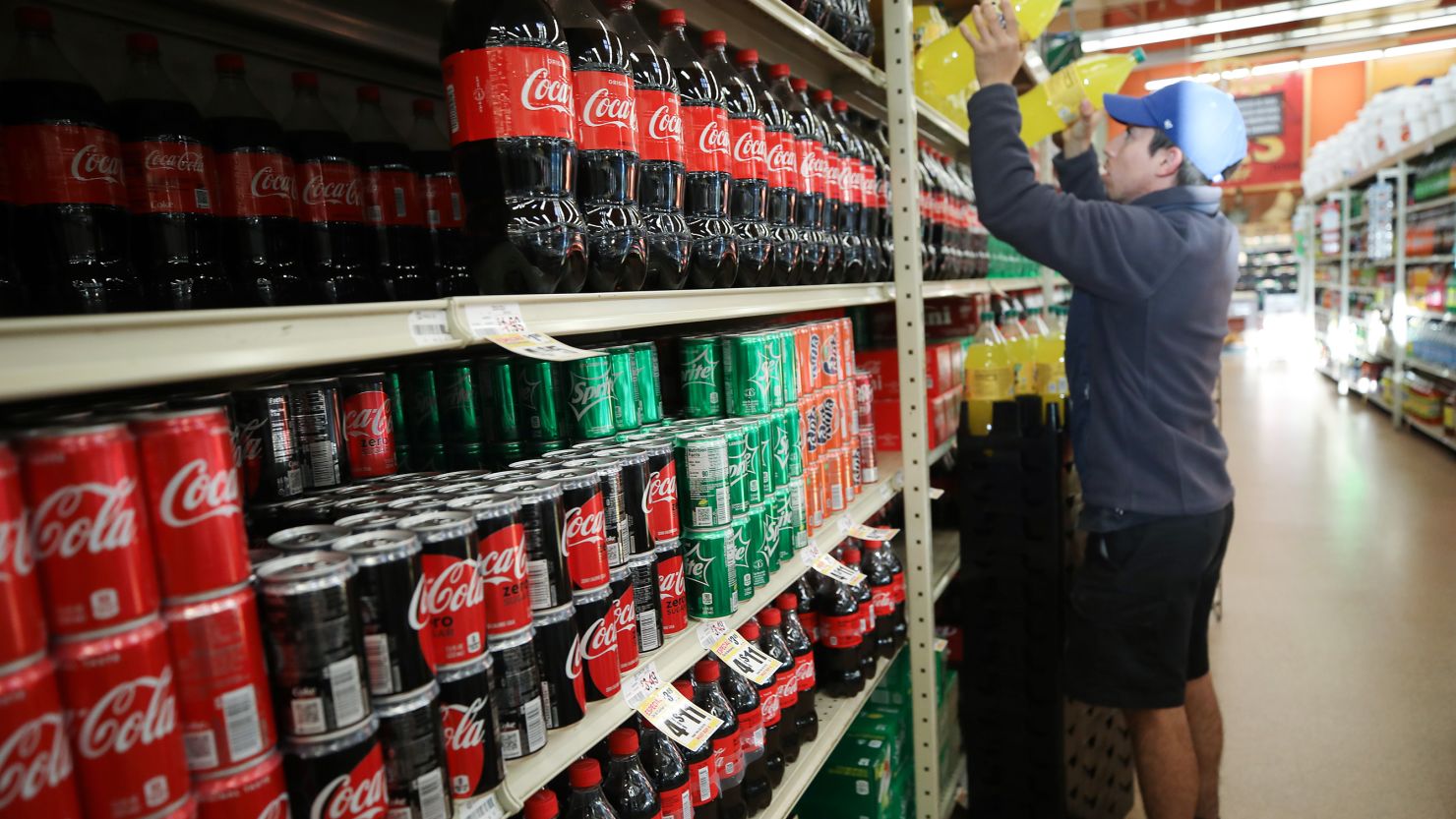 A worker restocks sodas at Northgate Gonzalez Market in Los Angeles on March 19, 2020.