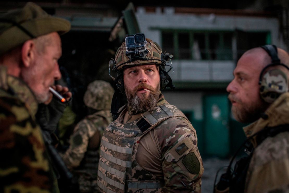 Ukrainian soldiers talk during heavy fighting against Russia at the front line in Severodonetsk on June 8, 2022.