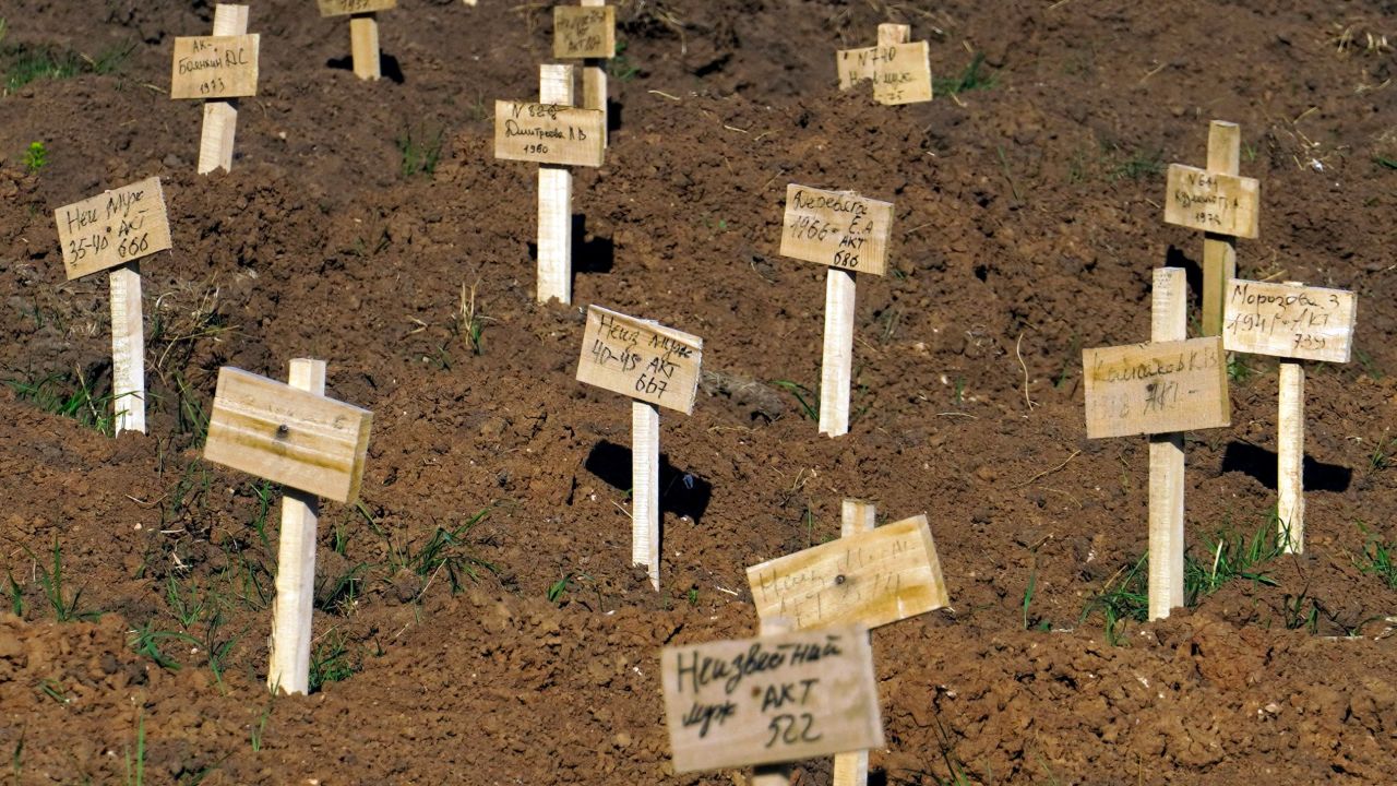 Fresh graves are seen at a cemetery in the city of Mariupol on June 2, 2022.