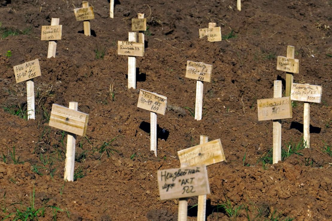 Fresh graves are seen at a cemetery in the city of Mariupol on June 2, 2022.