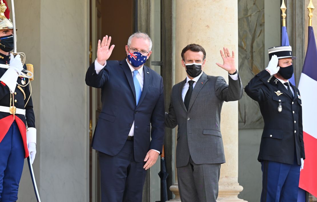 French President Emmanuel Macron (R) and Australian Prime Minister Scott Morrison (L) pose before dinner at the Elysee Palace in Paris, France on June 15, 2021.