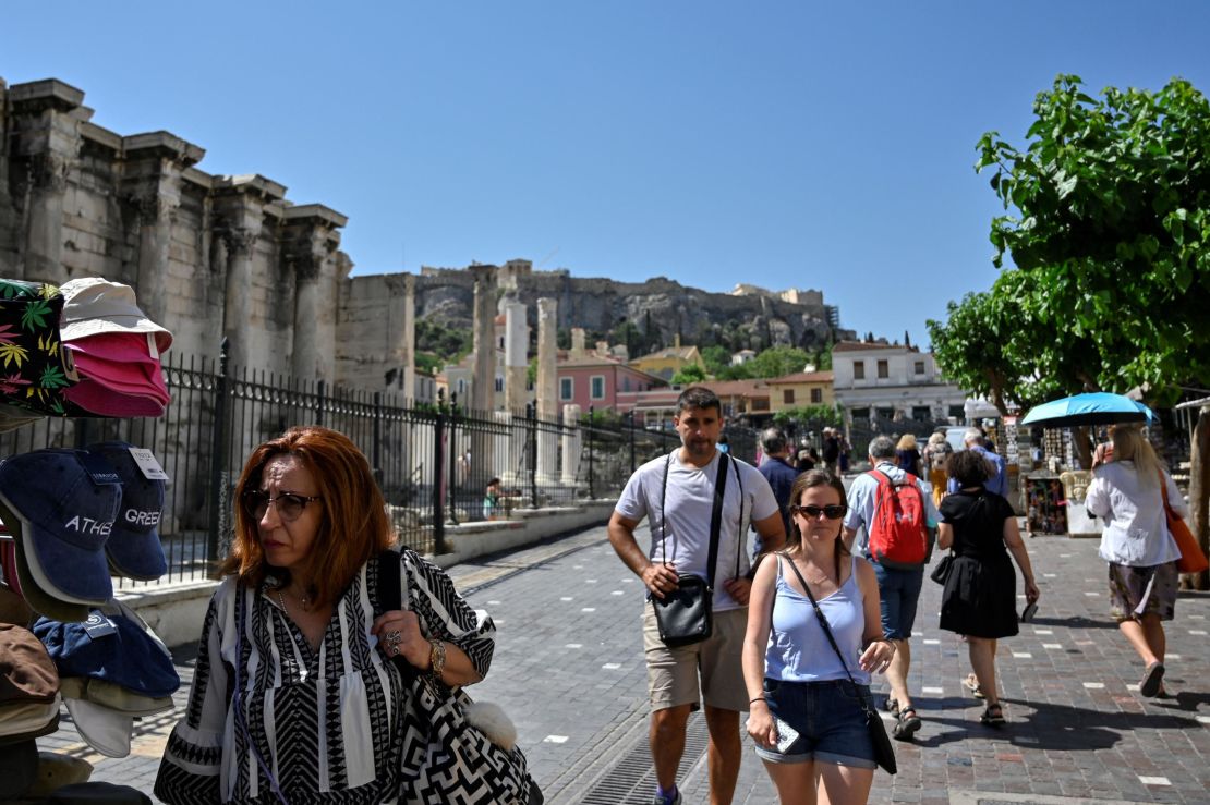 Tourists and locals stroll in a tourism-heavy area of Athens, Greece, on June 1, 2022.