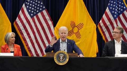 President Joe Biden speaks during a briefing on the New Mexico wildfires at the State Emergency Operations Center in Santa Fe on June 11, 2022. Also pictured are New Mexico Gov. Michelle Lujan Grisham, left, and David Dye, New Mexico secretary of homeland security and emergency management.