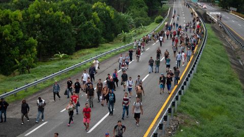 Migrants taking part in a caravan heading to the US, walk from Huixtla to Escuintla, Chiapas state, Mexico, on June 9, 2022.