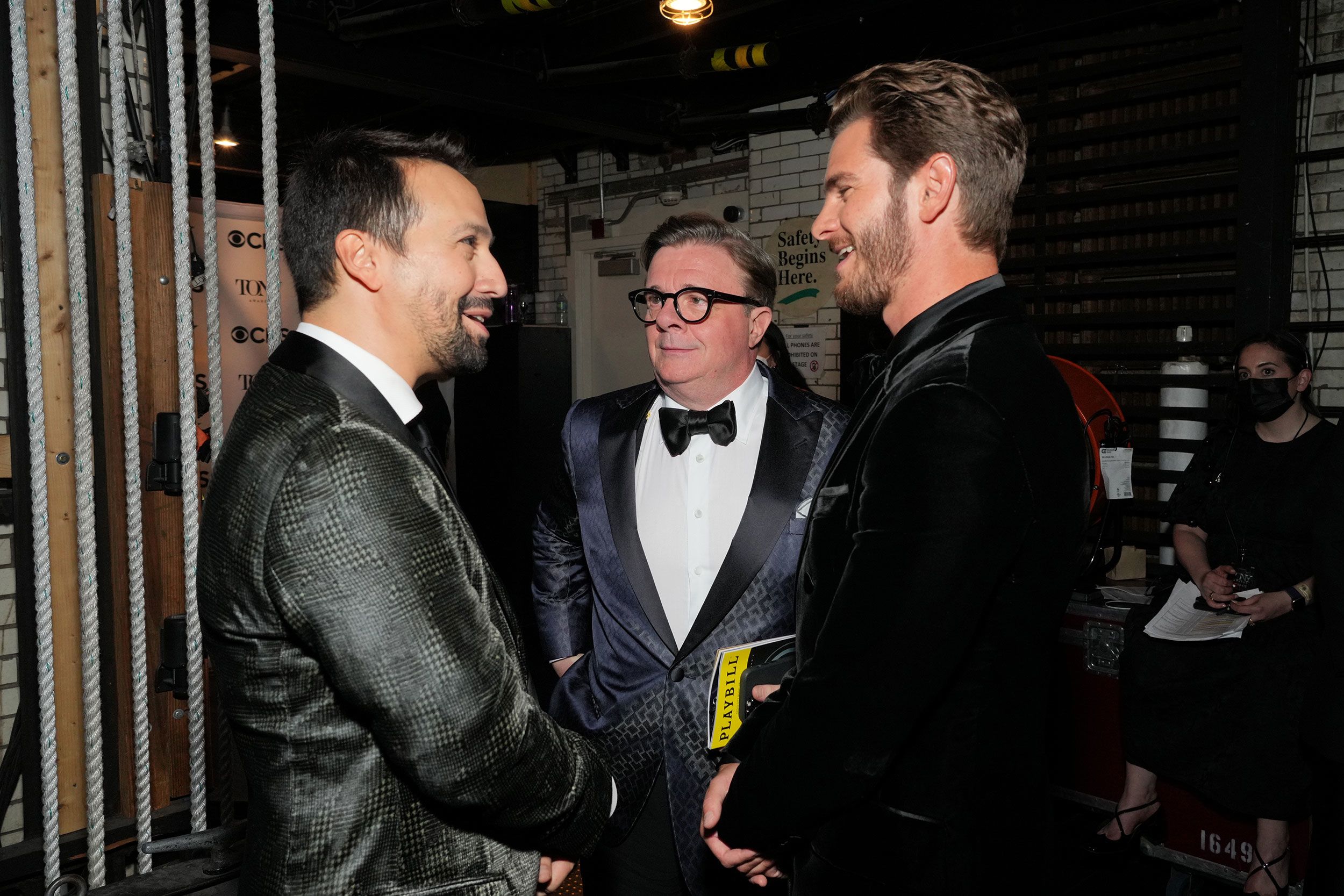 From left to right, Lin-Manuel Miranda, Nathan Lane and Andrew Garfield talk backstage.