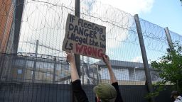Demonstrators protest outside of Brook House Immigration Removal Centre against a planned deportation of asylum seekers from Britain to Rwanda, at Gatwick Airport near Crawley, Britain, June 12, 2022.