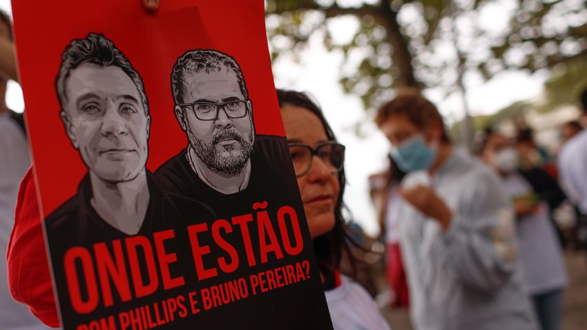 Brazilian actress Lucelia Santos holds a poster with images of British journalist Dom Phillips, left, and expert on indigenous affairs Bruno Araujo Pereira following their disappearance in the Amazon, during a protest in Copacabana beach, Rio de Janeiro, Brazil, Sunday, June 12, 2022. Federal Police and military forces are carrying out searches and investigations into the disappearance of Phillips and Pereira in the Javari Valley Indigenous territory, a remote area of the Amazon rainforest in Atalaia do Norte, Amazonas state.