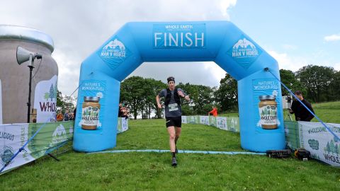 Ricky Lightfoot crosses the finish line to win first place at the Whole Earth Man V Horse Race in Llanwrtyd Wells, Wales. 
