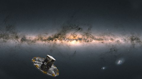 An artist's impression of ESA's Gaia satellite observing the Milky Way. The background image of the sky is compiled from data from more than 1.8 billion stars. 