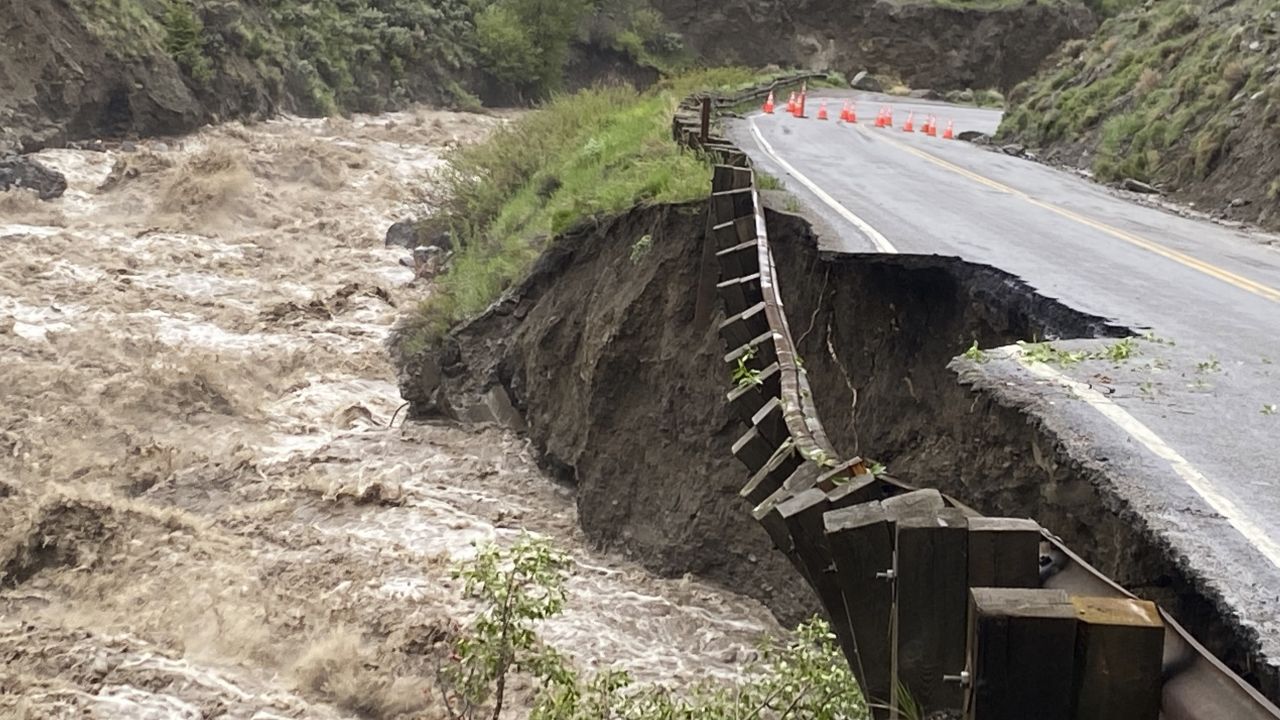 A road in Yellowstone National Park partially collapsed due to flooding Monday. 