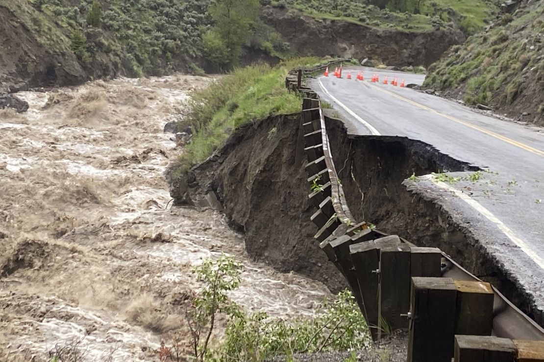A road in Yellowstone National Park partially collapsed due to flooding Monday. 