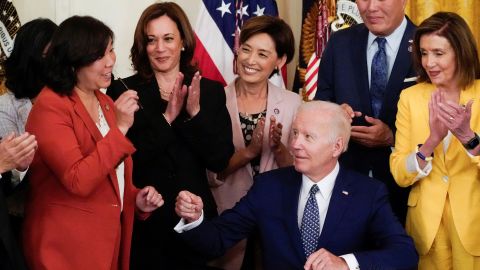 U.S. President Joe Biden receives a pen from Representative Grace Meng next to U.S. Vice President Kamala Harris and Speaker of the House of Representatives Nancy Pelosi at the signage ceremony of the H.R. 3525, the "Commission To Study the Potential Creation of a National Museum of Asian Pacific American History and Culture Act" at the White House in Washington, U.S., June 13, 2022. 
