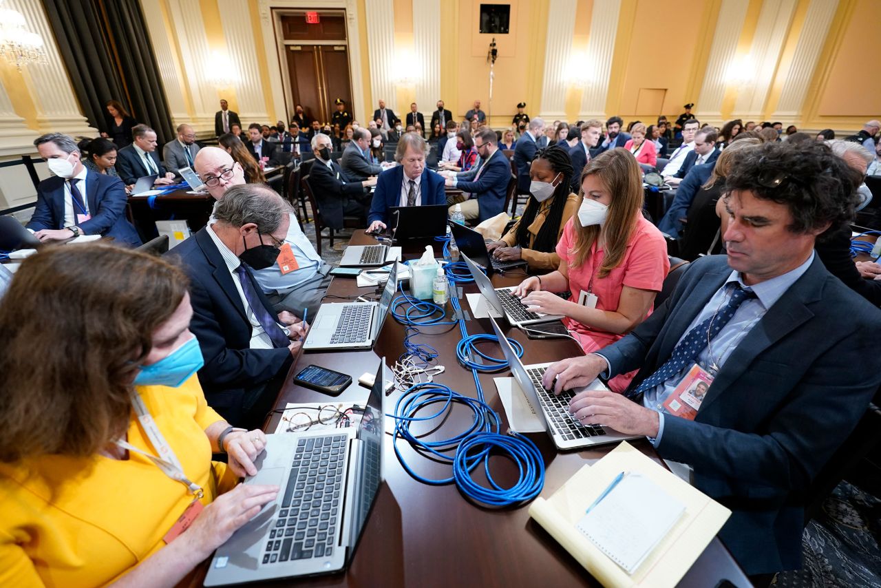 Members of the media work at the Capitol on June 13.
