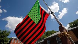A stylized American Black Lives Matter flag flies during a Juneteenth rally in Boston on Friday, June 19, 2020.