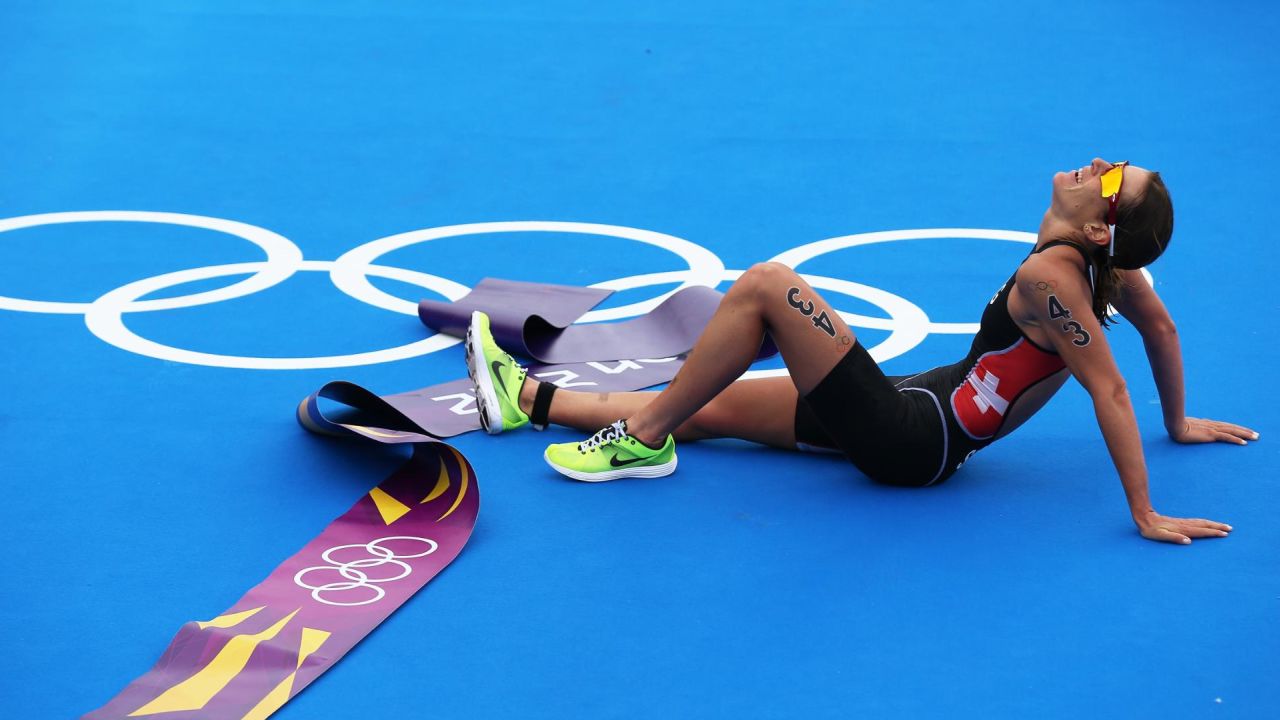 An exhausted Spirig lies on the ground at the end of the London 2012 Olympics. 