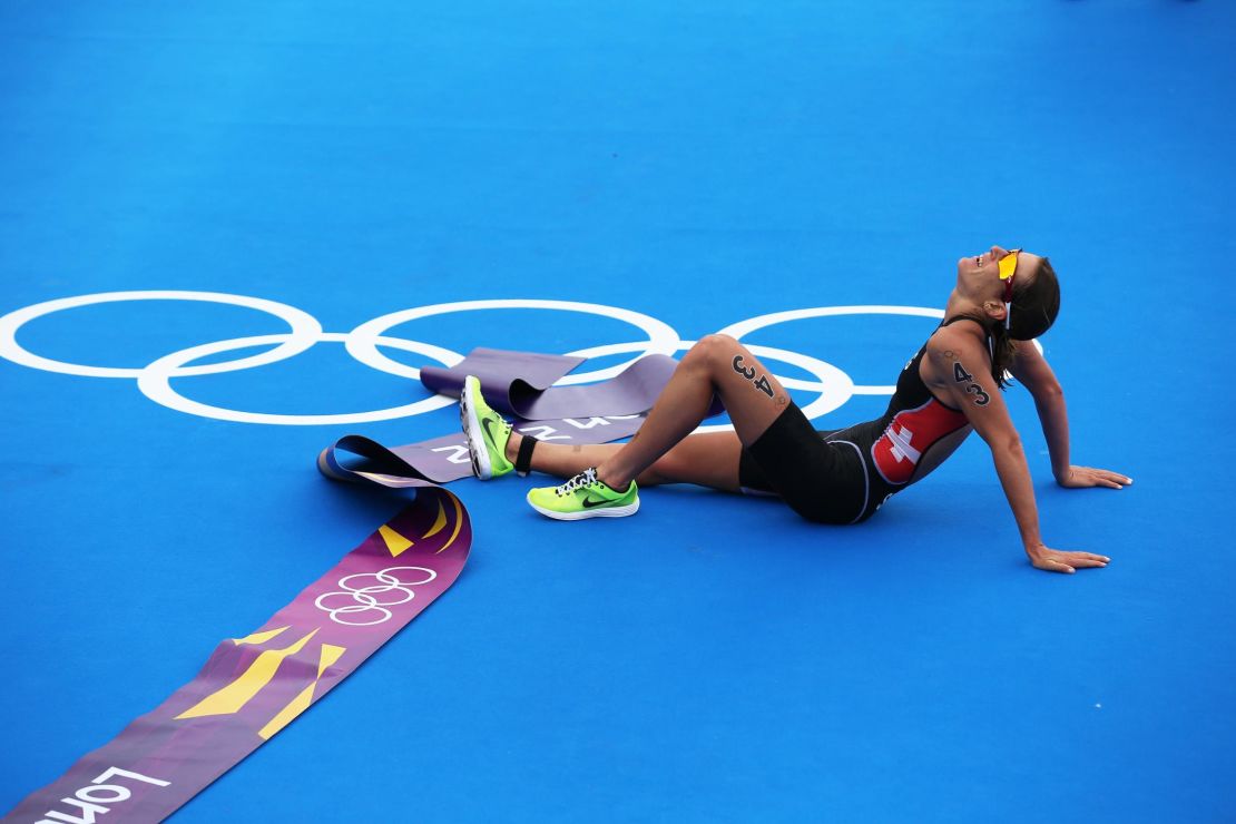 An exhausted Spirig lies on the ground at the end of the London 2012 Olympics. 