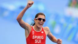 RIO DE JANEIRO, BRAZIL - AUGUST 20: Nicola Spirig Hug of Switzerland celebrates as she approaches the line to win silver during the Women's Triathlon on Day 15 of the Rio 2016 Olympic Games at Fort Copacabana on August 20, 2016 in Rio de Janeiro, Brazil. (Photo by Quinn Rooney/Getty Images)