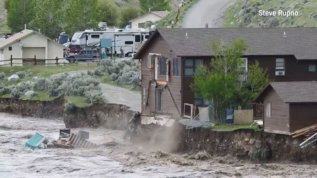 Part of a home in Gardiner, Montana, is swept away by floodwaters. 