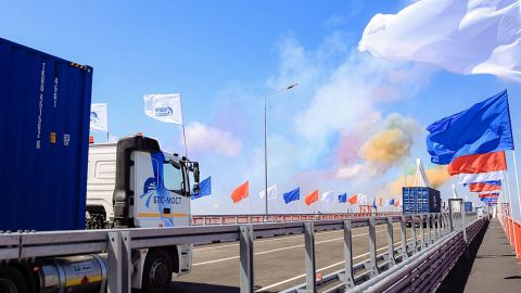 Russian trucks drive across the Amur River from Blagoveshchensk to China's Heihe city at an opening ceremony for the first highway bridge connecting the two countries over the river. 
