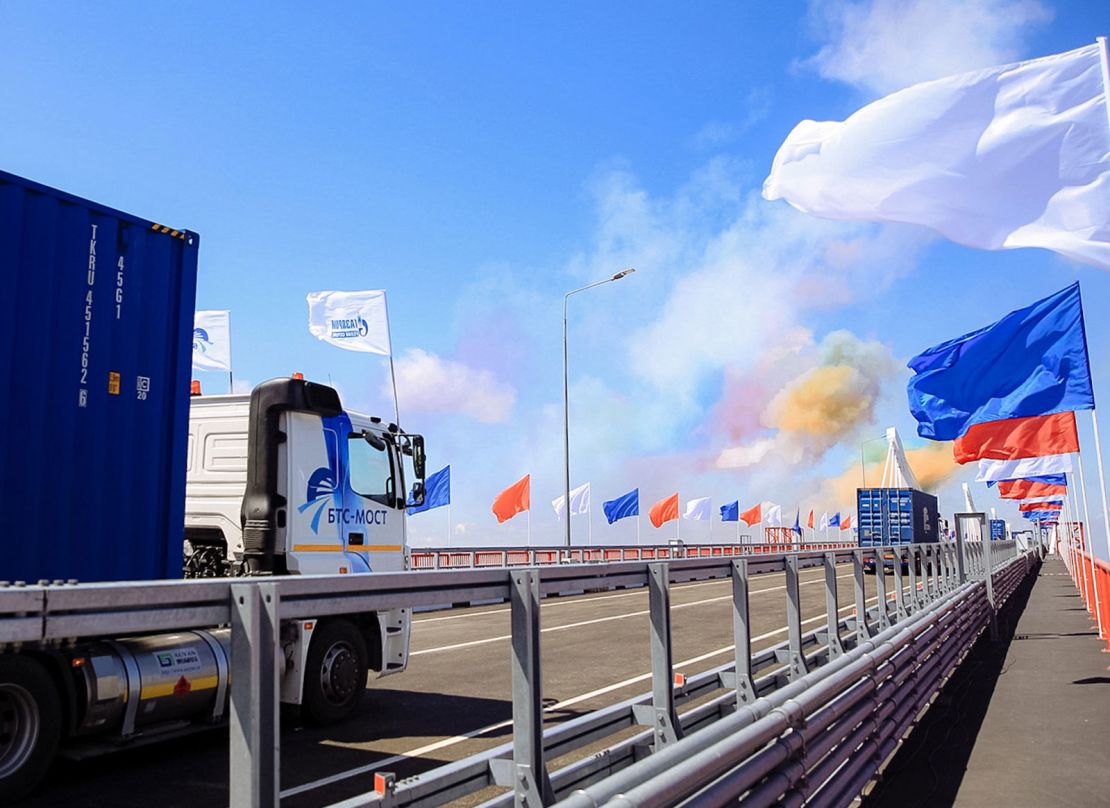 Russian trucks drive across the Amur River from Blagoveshchensk to China's Heihe city at an opening ceremony for the first highway bridge connecting the two countries over the river. 