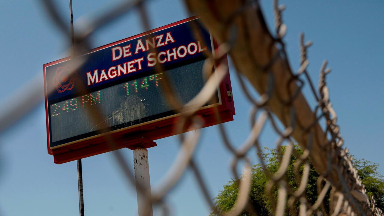 A temperature of 114 degrees is displayed Sunday on a digital sign outside De Anza Magnet School in El Centro, California.  