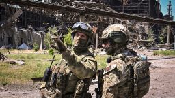 Russian servicemen guard an area of the Azovstal steel plant in Mariupol on June 13, 2022, amid the ongoing Russian military action in Ukraine. (Photo by Yuri KADOBNOV / AFP) (Photo by YURI KADOBNOV/AFP via Getty Images)