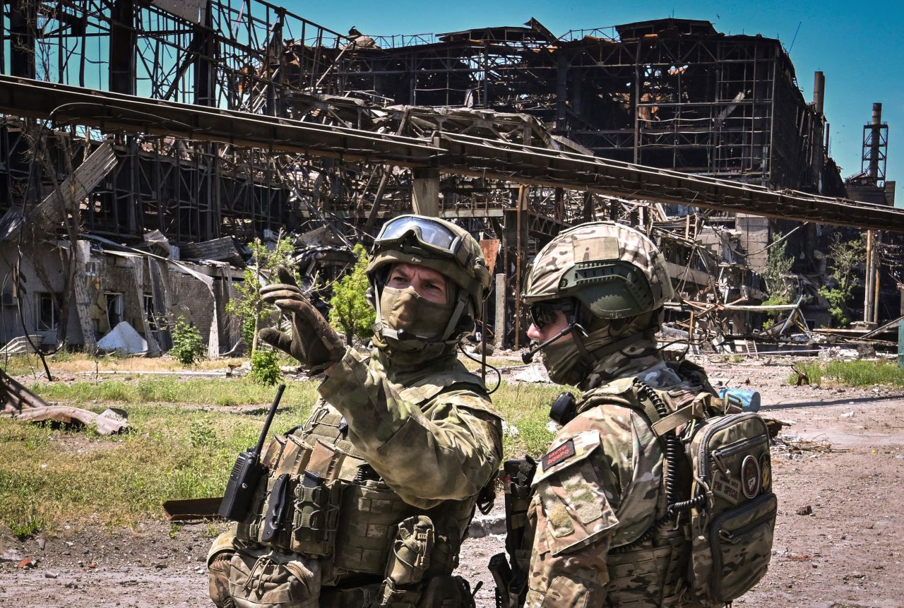 Russian servicemen guard an area of the Azovstal steel plant in Mariupol, Ukraine, on June 13.