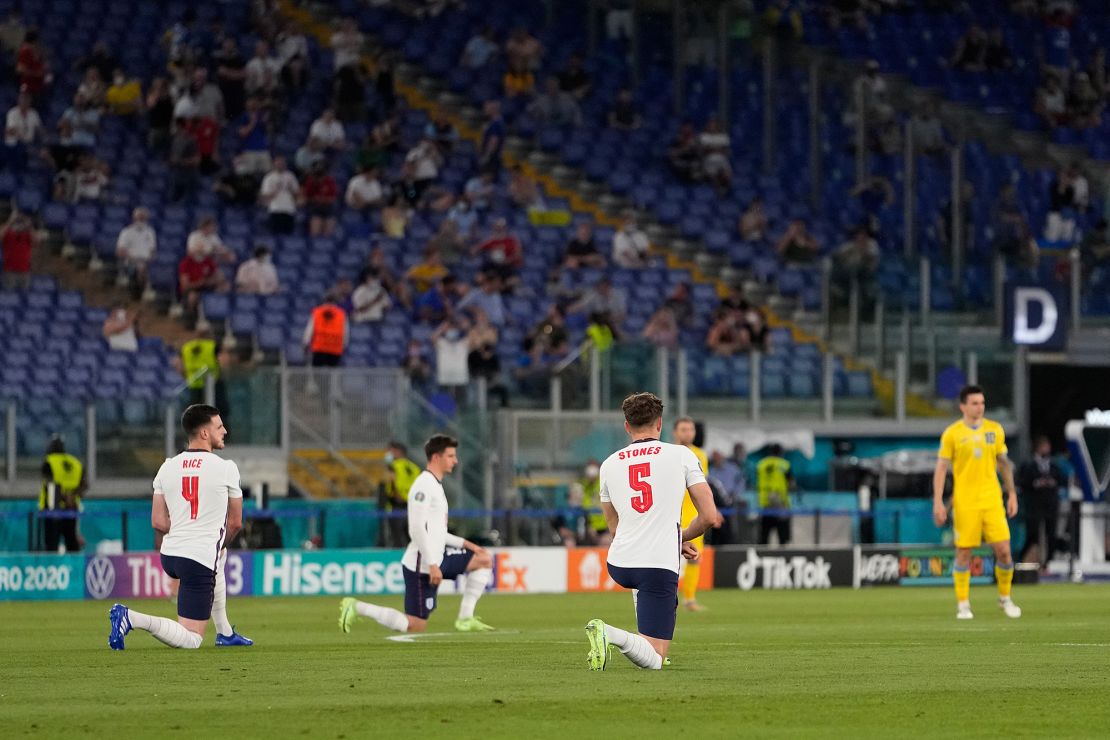 Declan Rice (far left) and John Stones (center right) take the knee prior to England's Euro 2020 quarterfinal against Ukraine.