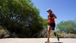 Jacky Hunt-Broersma runs her 102nd marathon in 102 days, this one at Veterans Oasis Park, Thursday, April 28, 2022, in Chandler, Ariz. (AP Photo/Ross D. Franklin)