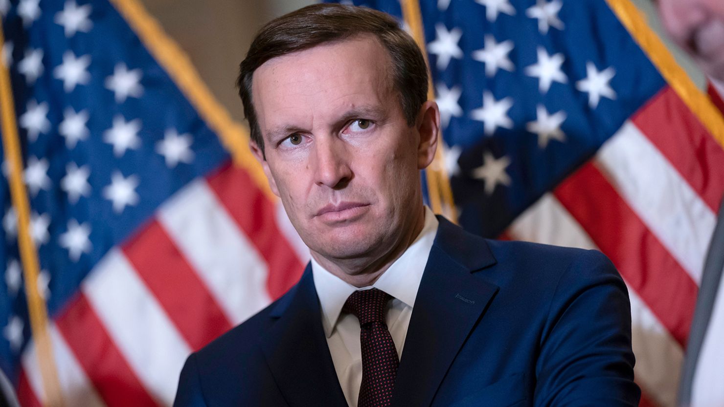 Sen. Chris Murphy waits to speak to reporters outside the chamber to answer questions about his efforts to reach a bipartisan Senate agreement to rein in gun violence at the Capitol in Washington on Tuesday, June 14, 2022.
