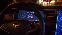 An instrument panel with the Tesla Motors Inc. 8.0 software update displays an autopilot disengagement warning inside a Model S P90D vehicle in the Brooklyn borough of New York, U.S., on Tuesday, Sept. 20, 2016. 