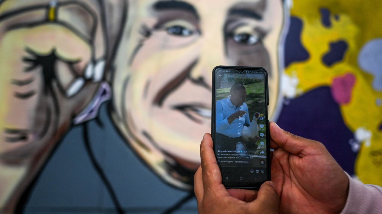 A person looks at Rodolfo's TikTok account in Bogota earlier this month.