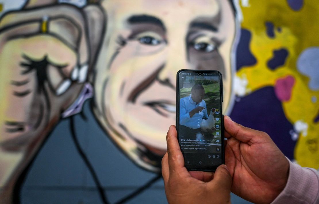 A person looks at Rodolfo's TikTok account in Bogota earlier this month. 