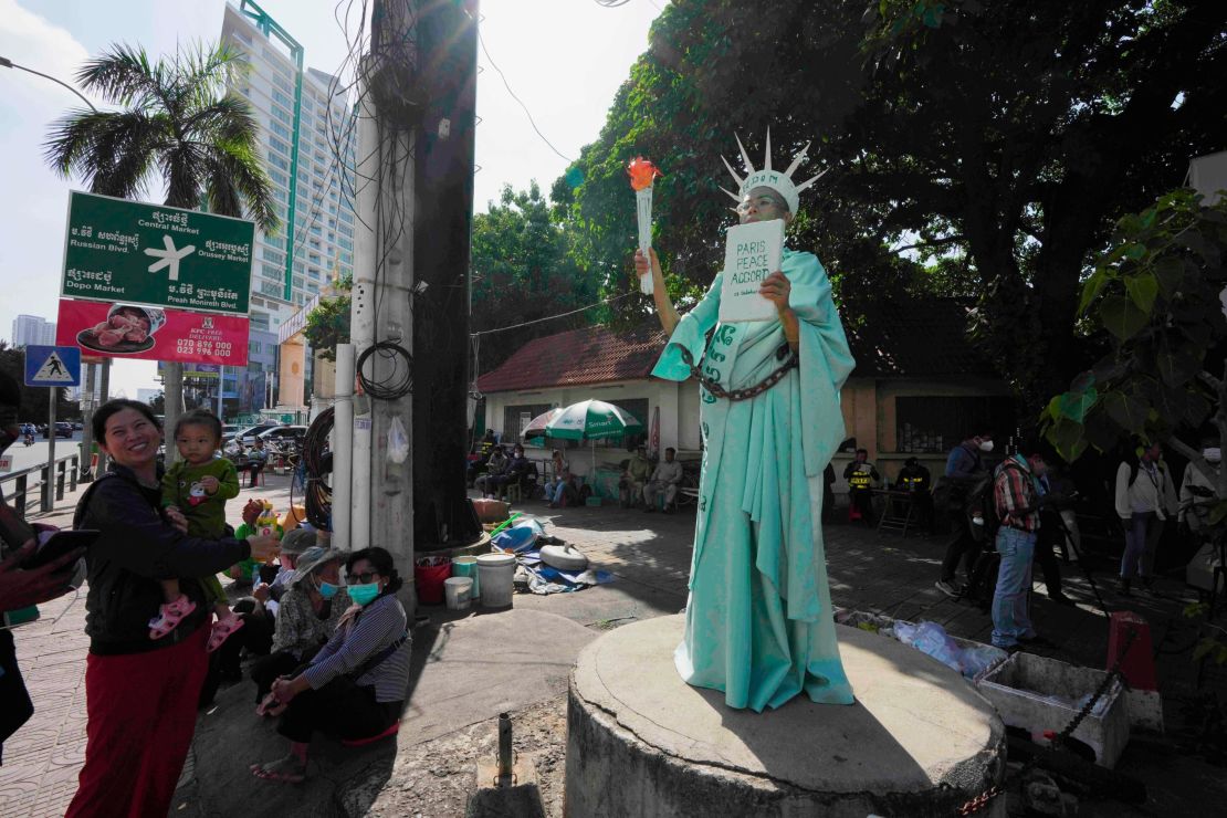 Theary Seng stands outside the Phnom Penh Municipal Court on Tuesday.